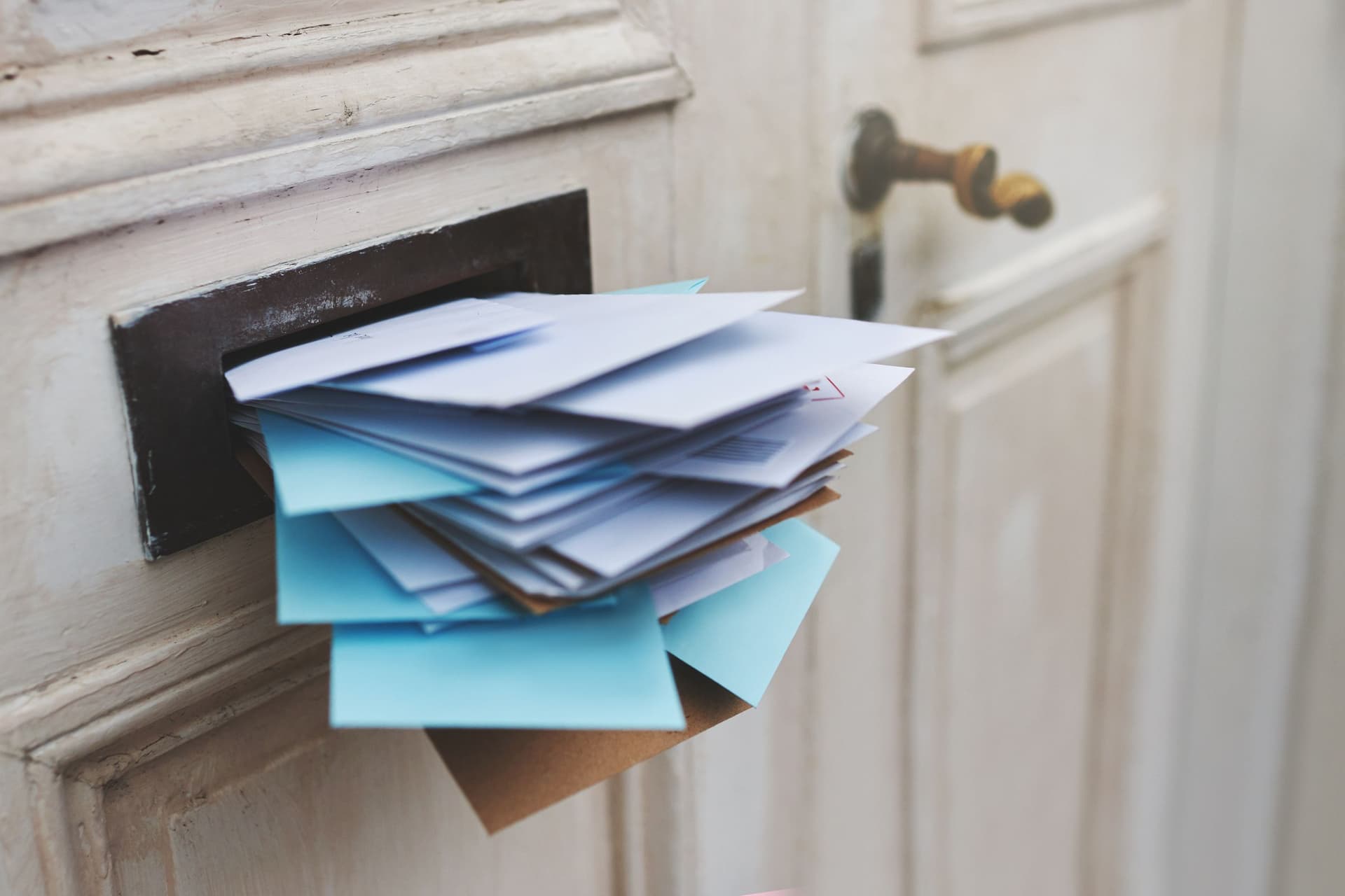 Letters stuffed into mailbox